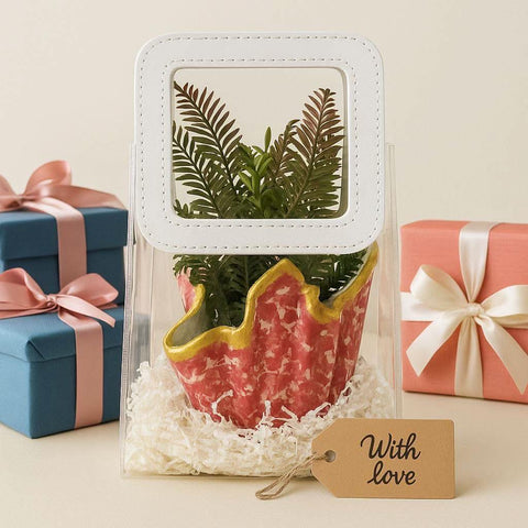 Luxury planter gift set — front view of designer red planter with faux greenery