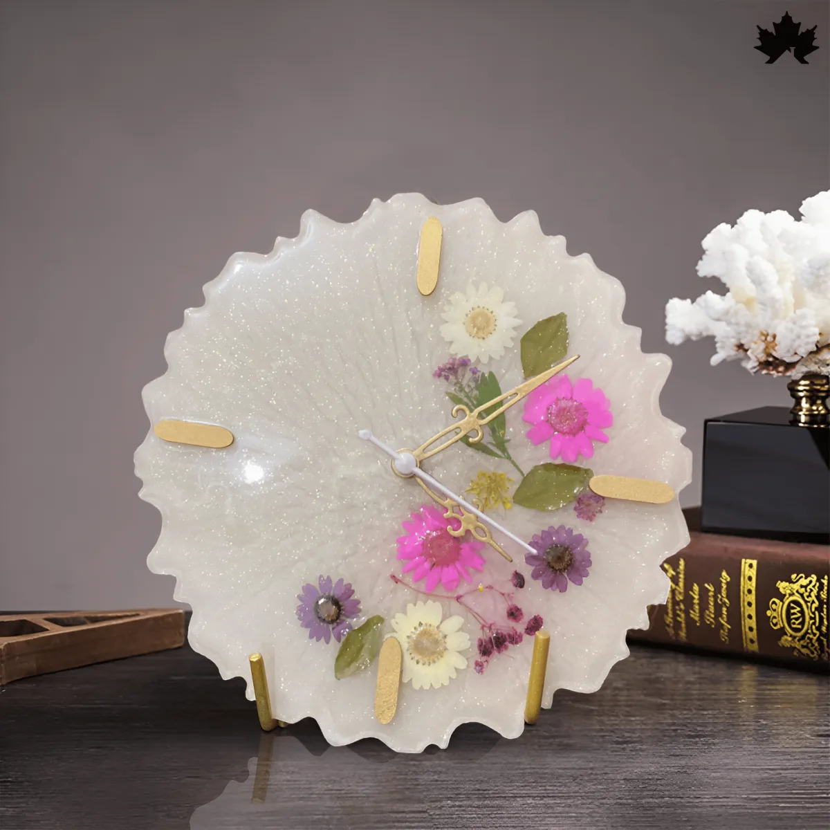 Blossom Time - An elegant office clock from Fankaarlok, showcasing a delicate arrangement of real flowers encased within a clear resin on a scalloped ivory background, enhanced with golden hour markers for a sophisticated look.