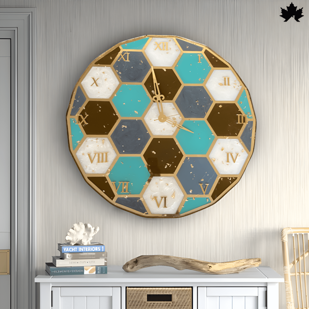 Stylish wall clock featuring a geometric design with hexagonal segments in teal, gold, and dark gray, each outlined in gold. The clock numbers are in Roman numerals, adding a classic touch to its modern aesthetic. This clock is mounted on a light gray wall above a chic console table, blending functionality with contemporary home decor.