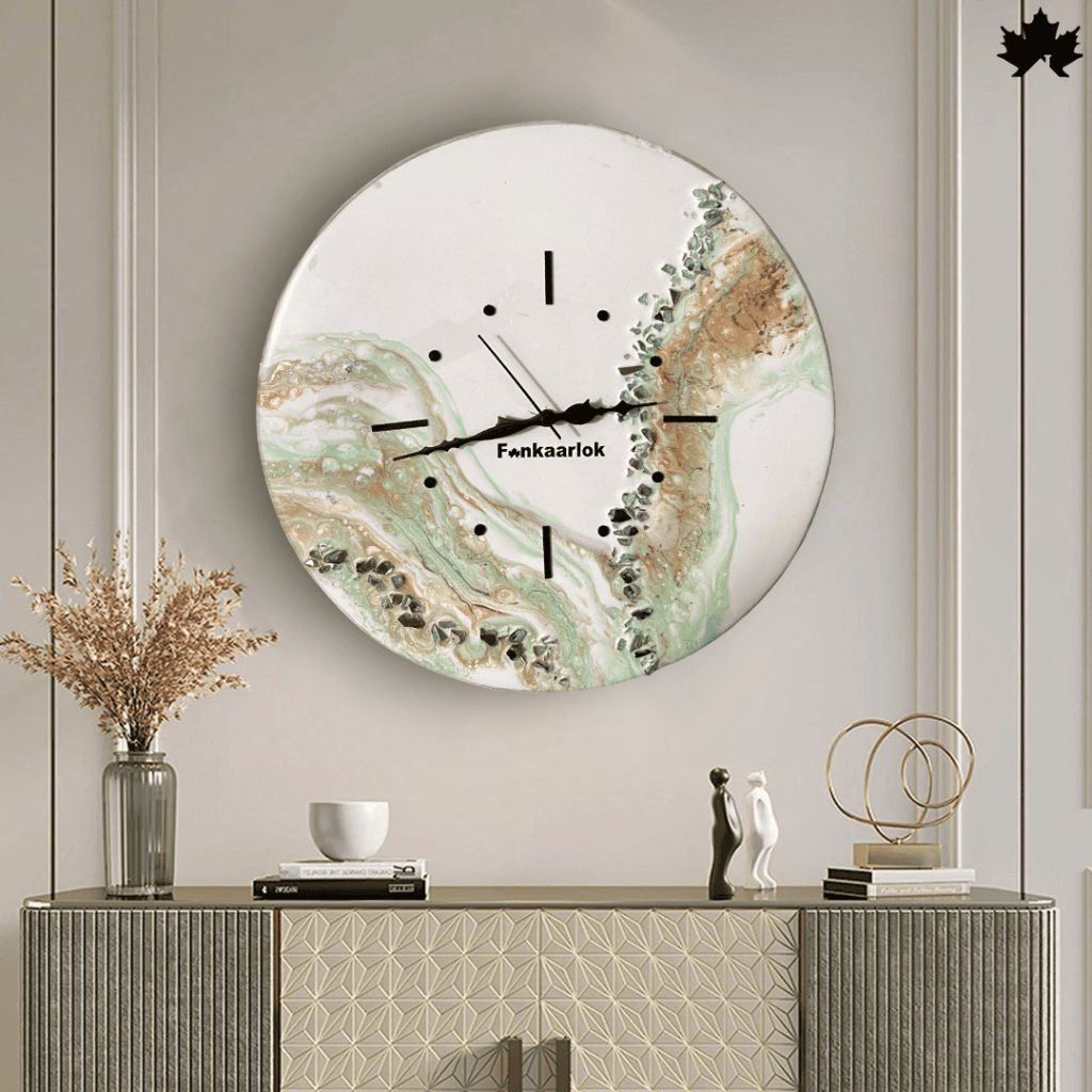 A contemporary and Modern Wall Clock featuring a serene marble design with swirling patterns of green, beige, and white, accented by gold and black details. The clock face includes sleek black hour markers and the Fankaarlok logo, making it an elegant addition to any modern interior.