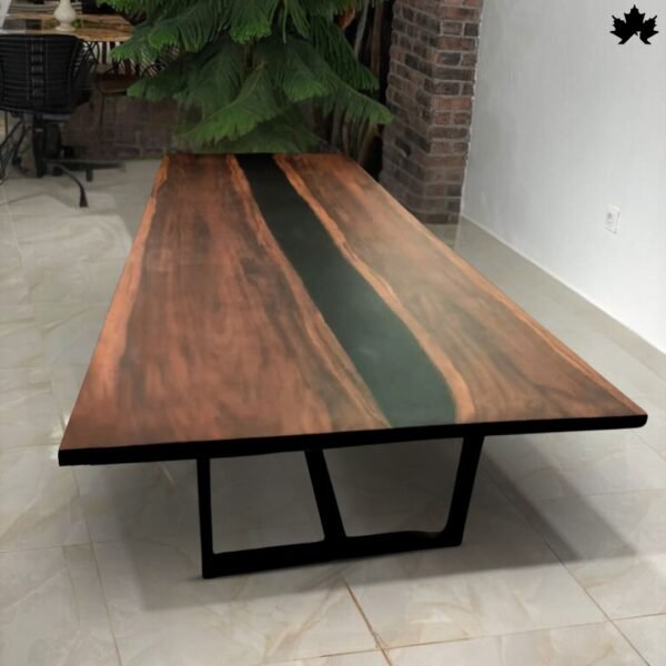 Elegant large dining table with a deep mahogany finish and a centered green resin streak, supported by a robust black metal base, placed in a spacious room with natural decor elements.