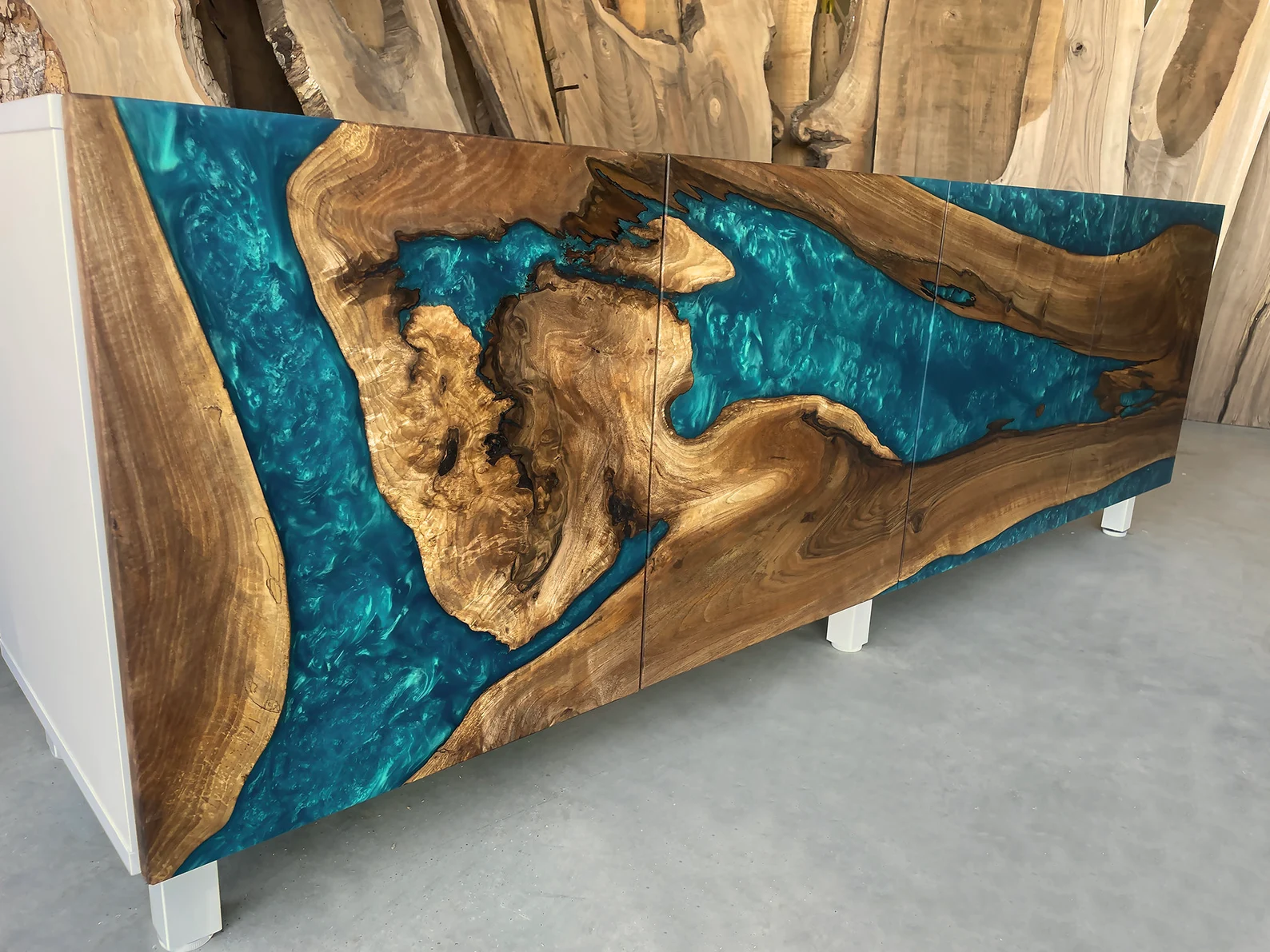 "Stunning Fankaarlok luxury cabinets combining natural wood curves with striking blue resin, perfect for modern homes"